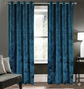 Navy blackout curtains set of 2 hanging on window in modern room