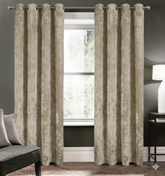 beige blackout curtains set of 2 hanging on window in modern room