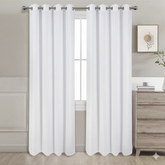 White semi-blackout curtains set of 2 hanging on window in modern room