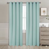 Mint semi-blackout curtains set of 2 hanging on window in modern room