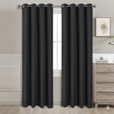 Black semi-blackout curtains set of 2 hanging on window in modern room