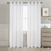 White sheer curtains set of 2 hanging on window in bright room