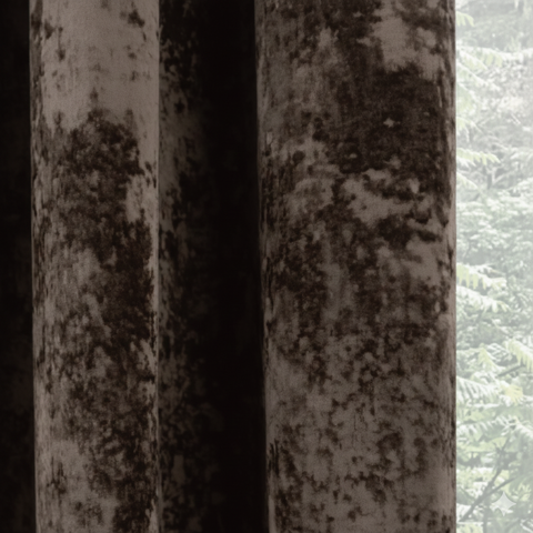 Close-up of brown blackout curtain fabric showing thick texture