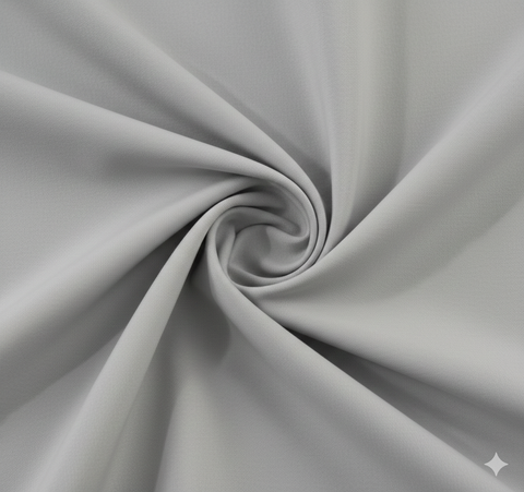 Grey semi-blackout curtain fabric with smooth texture and elegant drape