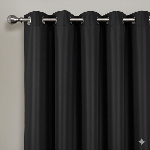 Black semi-blackout curtains with metal grommets on curtain rod