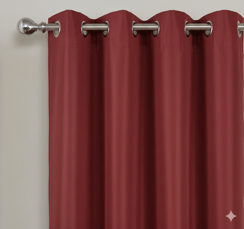 Red semi-blackout curtains with metal grommets on curtain rod