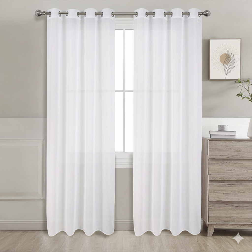 White sheer curtains set of 2 hanging on window in bright room