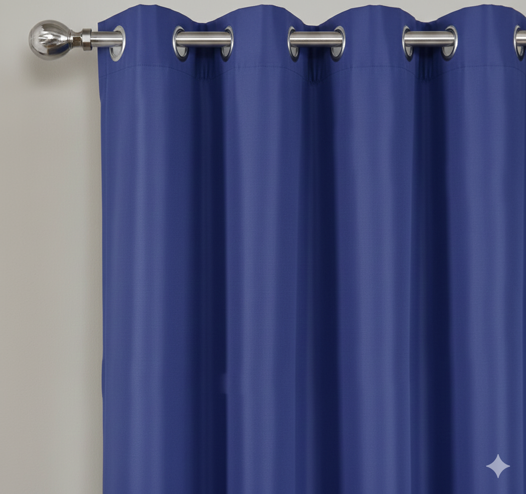 Navy semi-blackout curtains with metal grommets on curtain rod