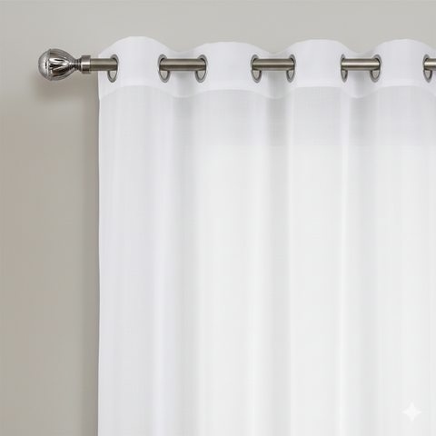 White sheer curtains with metal grommets on curtain rod